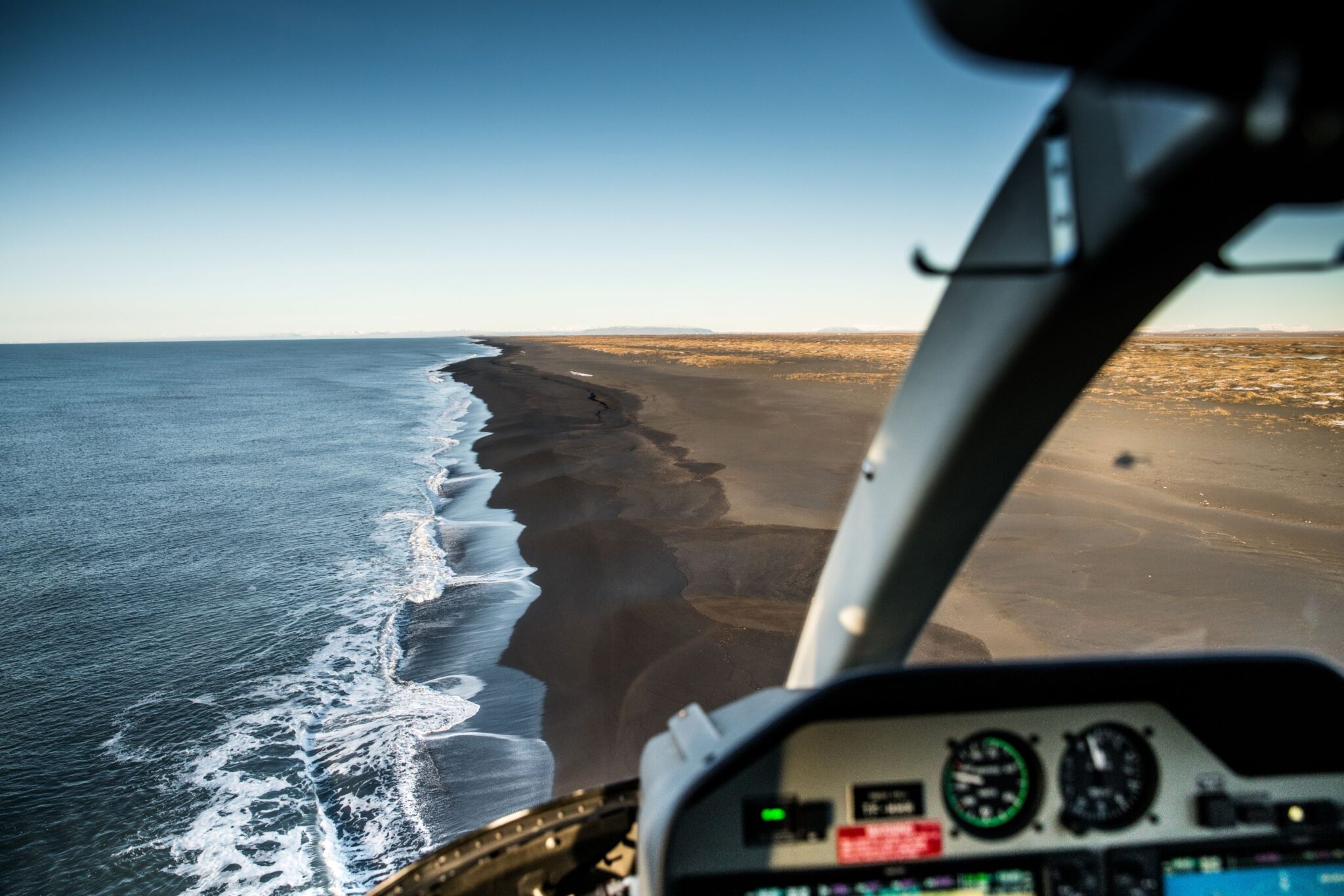 Helicopter flight over Icelandic coastline